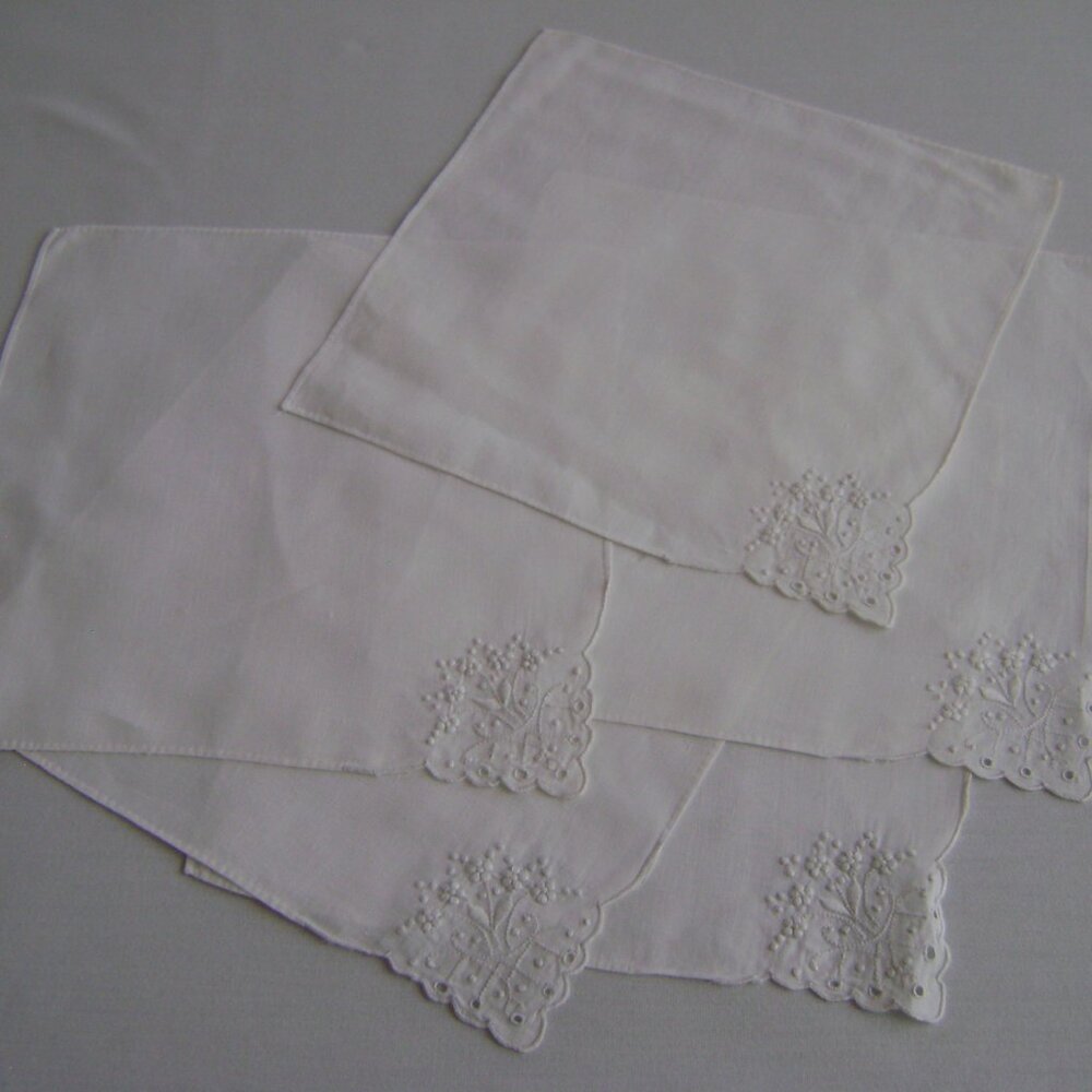 Lot of 12 vintage white napkins with embroidery and/or cut out work on 9.